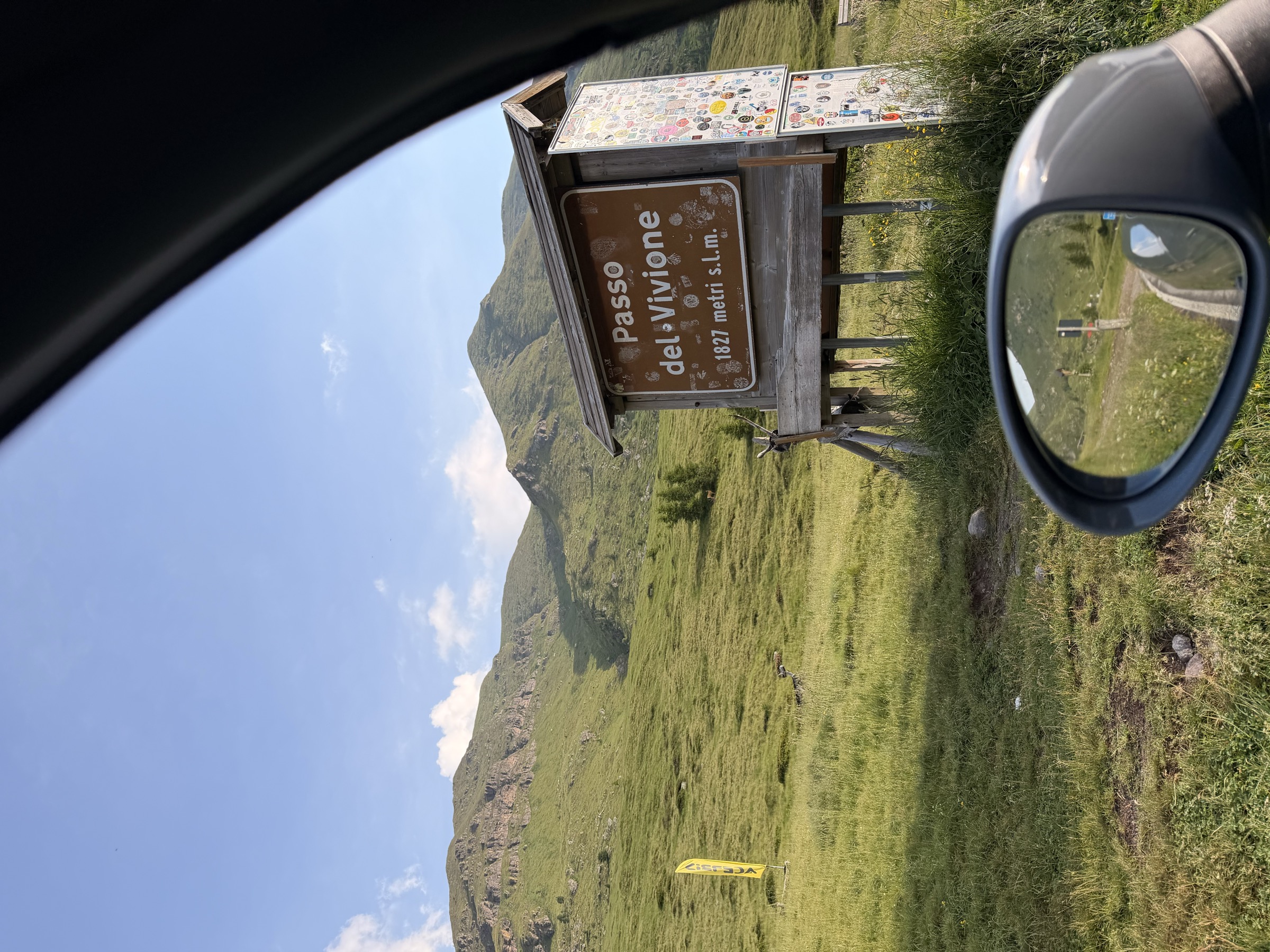 Passo del Vivione summit sign, 1827 metres, seen through the car window